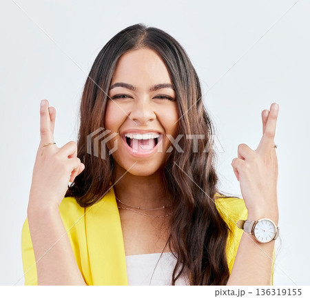 Wish, fingers crossed and portrait of woman in studio with hand gesture for winning, good luck and hopeful. Winner, white background and excited female person for competition, promotion and lottery 136319155