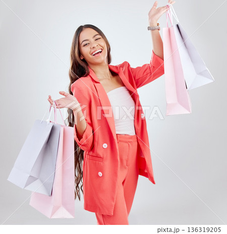 Happy customer, excited or portrait of woman with shopping bags for retail sale, store offer or discount deal. Choice, smile or girl shopper holding gifts or product on promotion on white background 136319205