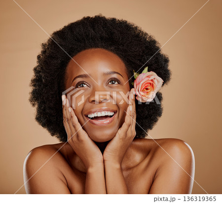 Face, black woman and skincare with rose for beauty in studio isolated on a brown background. Floral flower, excited and African model with natural cosmetics, thinking and organic facial treatment. Face, black woman and skincare with rose for beauty in studio isolated on a brown background. Floral flower, excited and African model with natural cosmetics, thinking and organic facial treatment. 136319365
