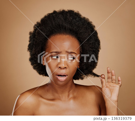 Worry, black woman and hair problem for afro in studio isolated on a brown background. Damage, hairstyle and sad African model with split ends, frizz and loss after natural salon treatment for beauty Worry, black woman and hair problem for afro in studio isolated on a brown background. Damage, hairstyle and sad African model with split ends, frizz and loss after natural salon treatment for beauty 136319379