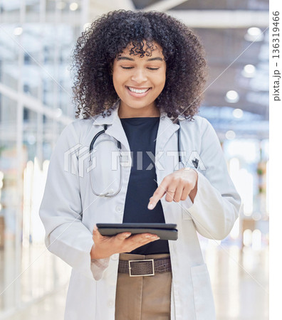 Happy, doctor and woman with tablet for research in hospital, telehealth and healthcare. Technology, medical professional and African person on app for wellness, internet and typing email in clinic. Happy, doctor and woman with tablet for research in hospital, telehealth and healthcare. Technology, medical professional and African person on app for wellness, internet and typing email in clinic. 136319466