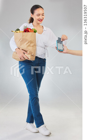 Card machine, grocery shopping and woman for business, POS and shop payment, fintech or digital finance. Groceries, credit and cashier hands, people and food bag at point of sale on studio background Card machine, grocery shopping and woman for business, POS and shop payment, fintech or digital finance. Groceries, credit and cashier hands, people and food bag at point of sale on studio background 136319507