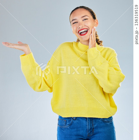 Space, smile and presentation with portrait of woman in studio for show, advertising and idea. Announcement, promotion and deal with person on grey background for opportunity, offer and news Space, smile and presentation with portrait of woman in studio for show, advertising and idea. Announcement, promotion and deal with person on grey background for opportunity, offer and news 136319519