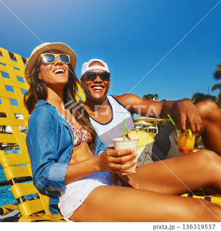 Couple, poolside and drinks in summer with happiness on holiday with alcohol at resort. Vacation, cocktails and pool with man or woman with alcohol in outdoor with sunshine, happy, sunglasses. 136319537