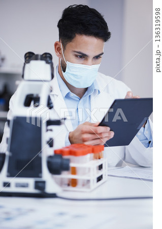 Blood test, tablet and scientist man with research analysis, vaccine and healthcare, face mask and laboratory data. Medical, science doctor or person with digital technology for covid or dna results 136319598