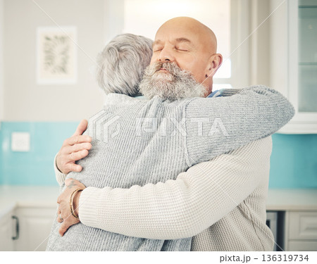 Love, romance and senior couple hugging in the kitchen together in their modern house. Happy, sweet and elderly man embracing his wife with care, affection and happiness for bonding in their home. Love, romance and senior couple hugging in the kitchen together in their modern house. Happy, sweet and elderly man embracing his wife with care, affection and happiness for bonding in their home. 136319734