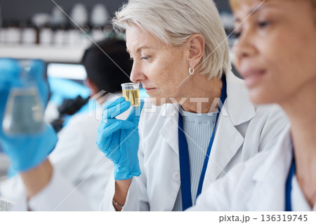 Essential oil, development and scientist smell sample in a lab doing research of organic and natural fragrance. Serum, treatment and collagen expert working on a skincare, perfume or beauty product Essential oil, development and scientist smell sample in a lab doing research of organic and natural fragrance. Serum, treatment and collagen expert working on a skincare, perfume or beauty product 136319745