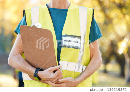 Clipboard, volunteering and person in park for cleaning, community service and pollution or sustainability checklist. Gardening, inspection and people hands for ngo or nonprofit, outdoor and nature 136319872