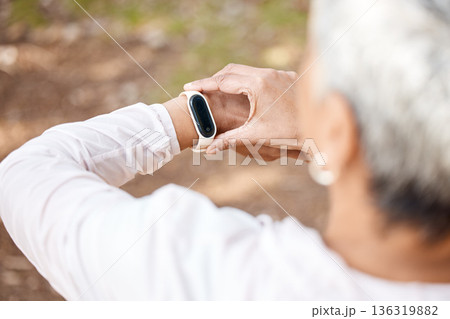 Senior woman, check smart watch and fitness in park to monitor speed, heart or progress. Outdoor, female runner and iot clock for time, training or exercise with stopwatch, nature or summer sunshine Senior woman, check smart watch and fitness in park to monitor speed, heart or progress. Outdoor, female runner and iot clock for time, training or exercise with stopwatch, nature or summer sunshine 136319882