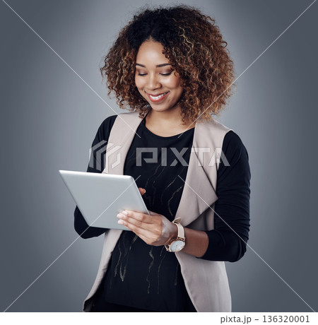 Online communication, businesswoman with tablet and against a studio background for accounting. Technology or connectivity, finance and woman accountant happy for financial report or data review Online communication, businesswoman with tablet and against a studio background for accounting. Technology or connectivity, finance and woman accountant happy for financial report or data review 136320001