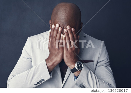 Sad, stress and business man crying, frustrated or depressed for financial mistake, debt or crisis. Corporate person with bankruptcy for finance fail or stock market crash isolated on dark background Sad, stress and business man crying, frustrated or depressed for financial mistake, debt or crisis. Corporate person with bankruptcy for finance fail or stock market crash isolated on dark background 136320017