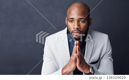 Praying, hands and business man with faith for career, job or opportunity, asking god for help and support. Corporate african person in prayer sign, religion and hope isolated on dark wall background 136320020