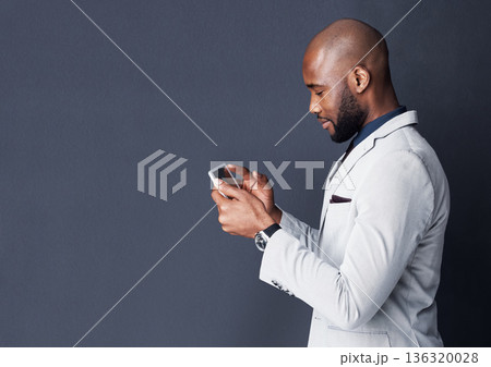 Tablet, reading and business man isolated on dark gray background, mockup and stock market research or sales. Accountant or african person in finance search or scroll on digital tech on a banner wall Tablet, reading and business man isolated on dark gray background, mockup and stock market research or sales. Accountant or african person in finance search or scroll on digital tech on a banner wall 136320028