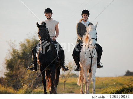 Horse ride, woman friends and countryside portrait with animal, calm and freedom on holiday and travel. Equestrian, people and field trip with pet in nature on vacation with rider outdoor on ranch Horse ride, woman friends and countryside portrait with animal, calm and freedom on holiday and travel. Equestrian, people and field trip with pet in nature on vacation with rider outdoor on ranch 136320082