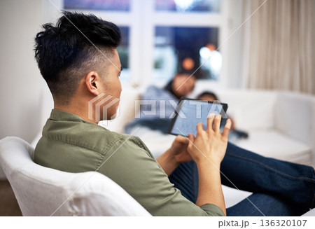 Man, tablet and remote work on couch in family home with review, charts and screen in living room. Person, graphs and click with tech, application and insight with project in lounge at apartment Man, tablet and remote work on couch in family home with review, charts and screen in living room. Person, graphs and click with tech, application and insight with project in lounge at apartment 136320107