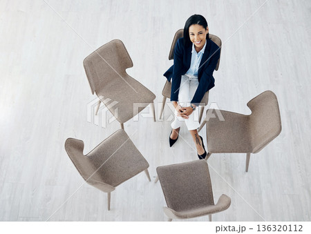 Business woman, waiting room and sitting on chair above for meeting, huddle or appointment at office. Top view of happy female person or employee in hiring, interview or social group at the workplace 136320112