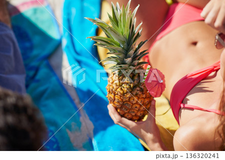 Pineapple drink, beach and woman in bikini for summer, holiday and tropical vacation with healthy food or juice. Cocktail drink, fruit and person relax outdoor in sunshine for travel and diet body 136320241