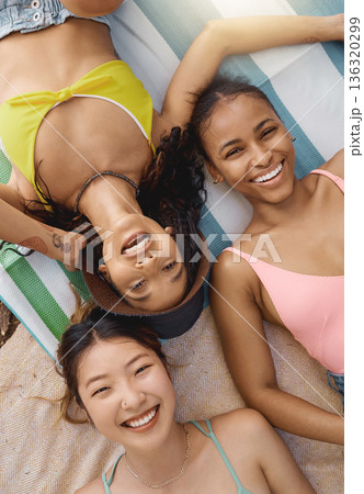 Friends, portrait and happiness, sunbathing with top view, adventure and diversity, female people have fun together outdoor. Lying down, sun and travel, young women with smile and freedom in summer Friends, portrait and happiness, sunbathing with top view, adventure and diversity, female people have fun together outdoor. Lying down, sun and travel, young women with smile and freedom in summer 136320299