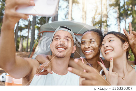 Happy, peace sign and selfie of friends camping in forest, woods or nature together. Smile, v hand and people taking picture for hiking, social media emoji or group memory outdoor on summer vacation. Happy, peace sign and selfie of friends camping in forest, woods or nature together. Smile, v hand and people taking picture for hiking, social media emoji or group memory outdoor on summer vacation. 136320307