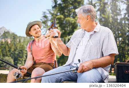 Fishing, lake and senior male or son with drink for happiness or adventure at forest on vacation. Hobby, river and rod with man and grandfather with beer on holiday together for bonding in nature. Fishing, lake and senior male or son with drink for happiness or adventure at forest on vacation. Hobby, river and rod with man and grandfather with beer on holiday together for bonding in nature. 136320404
