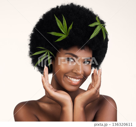 Black woman, leaves and marijuana in studio portrait, pride and organic skincare by white background. African girl, model or hemp for beauty, makeup or glow on skin for aesthetic, afro and cosmetics 136320611