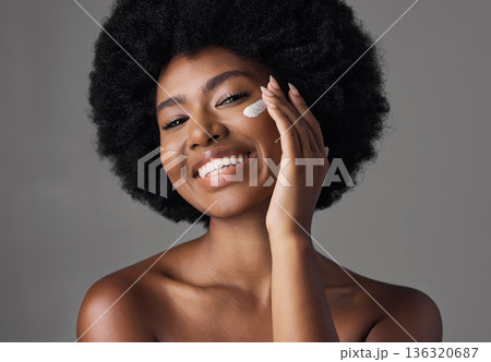 African woman, skincare cream or studio portrait with afro, face or cosmetic for smile by background. Girl, model and happy for natural self care with makeup, clean aesthetic and product for beauty 136320687