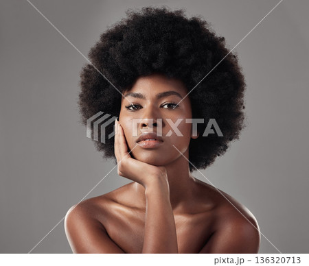 Skincare, black girl and makeup with confidence in portrait for wellness in studio background with afro. Beauty, face and glowing skin with african woman with cosmetics for dermatology with makeup. 136320713