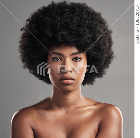 Skincare, portrait of a black woman and against a studio background for beauty cosmetics. Glowing or serious, cosmetology and face of African female person pose for confidence against a backdrop 136320717