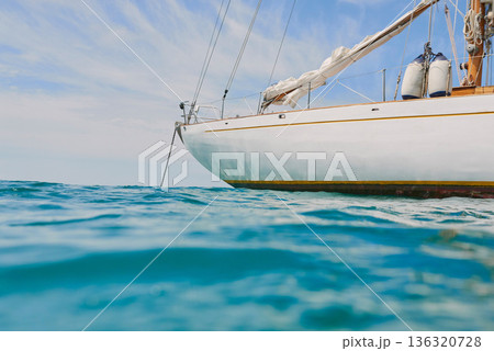 Travel, ocean and boat on water for cruise, luxury sailing and transport for holiday, vacation and trip. Travelling, summer and yacht in sea for tropical journey on seascape background or environment 136320728