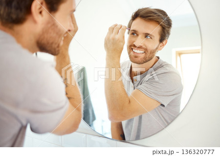 Man, tweezer and eyebrow in bathroom mirror with smile, self care and hygiene to start morning in home bathroom. Young guy, person and tool for beauty, facial cosmetics and wellness for hair removal Man, tweezer and eyebrow in bathroom mirror with smile, self care and hygiene to start morning in home bathroom. Young guy, person and tool for beauty, facial cosmetics and wellness for hair removal 136320777