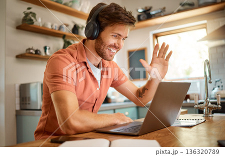 Wave, laptop and video call with man in kitchen for online meeting, remote work and virtual communication. Happy, hello and social media with person at home for technology, streaming and entrepreneur Wave, laptop and video call with man in kitchen for online meeting, remote work and virtual communication. Happy, hello and social media with person at home for technology, streaming and entrepreneur 136320789