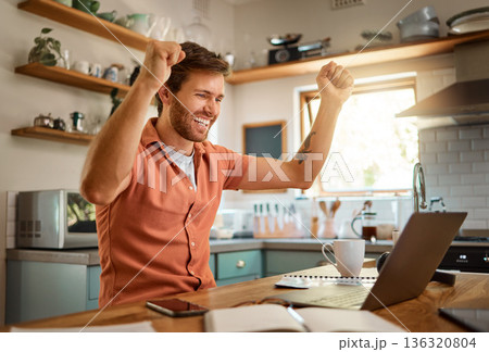 Happy, businessman celebrating and with laptop for remote work in kitchen of his home. Success or achievement, technology or networking and cheerful male person cheering for data review results Happy, businessman celebrating and with laptop for remote work in kitchen of his home. Success or achievement, technology or networking and cheerful male person cheering for data review results 136320804