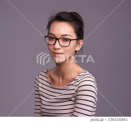 Portrait, fashion glasses and serious woman in studio isolated on a gray background mockup space. Face, nerd and female geek, person or model from Canada with trendy clothes, eyewear and casual style Portrait, fashion glasses and serious woman in studio isolated on a gray background mockup space. Face, nerd and female geek, person or model from Canada with trendy clothes, eyewear and casual style 136320861