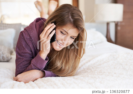 Phone call, bed and woman speaking and relax in a bedroom for a conversation or communication using a mobile app. Social network, home and happy female person talking online using cellphone internet Phone call, bed and woman speaking and relax in a bedroom for a conversation or communication using a mobile app. Social network, home and happy female person talking online using cellphone internet 136320877
