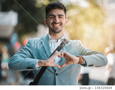 Hands in heart, business and portrait of man in city for support, startup goals and kindness in street. Travel, professional job and face of male worker with love emoji for career, working and job 136320884