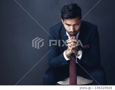 Business, thinking or Indian man with stress, anxiety or employee on a dark studio background. Male person, entrepreneur or consultant confused, planning or professional with company report or worry Business, thinking or Indian man with stress, anxiety or employee on a dark studio background. Male person, entrepreneur or consultant confused, planning or professional with company report or worry 136320926