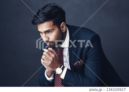 Business, thinking and Indian man with anxiety, depression and employee on a dark studio background. Male person, ceo or consultant with stress, planning or worry with mental health issue or confused Business, thinking and Indian man with anxiety, depression and employee on a dark studio background. Male person, ceo or consultant with stress, planning or worry with mental health issue or confused 136320927