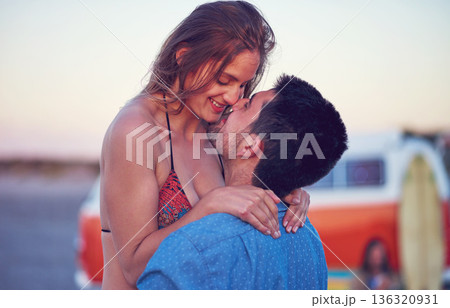 Couple, love and kiss at the beach on date, vacation or road trip in summer at sunset, together and romantic adventure. People, happy and support in relationship, happiness or boyfriend and girl Couple, love and kiss at the beach on date, vacation or road trip in summer at sunset, together and romantic adventure. People, happy and support in relationship, happiness or boyfriend and girl 136320931
