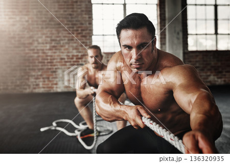 Men, gym and pull rope for exercise with strong muscle, coaching or teamwork for health, self care and together. Body builder partnership, focus and tug of war for workout, health or support on floor 136320935