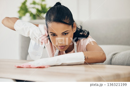 Woman, chemical spray and cleaning wooden table, hygiene with household maintenance and detergent. Female cleaner, disinfectant and wipe or clean dirt with cloth from surface and janitor service Woman, chemical spray and cleaning wooden table, hygiene with household maintenance and detergent. Female cleaner, disinfectant and wipe or clean dirt with cloth from surface and janitor service 136321199