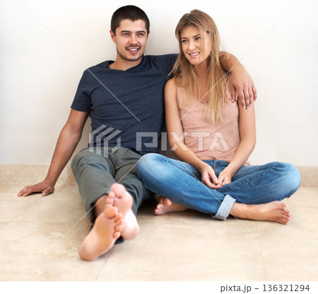 Hug, relax and couple on the floor of their new house talking, bond and excited for real estate success. Property, moving and man and woman sitting on living room ground together in their dream home Hug, relax and couple on the floor of their new house talking, bond and excited for real estate success. Property, moving and man and woman sitting on living room ground together in their dream home 136321294