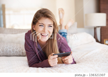 Teenager, happy and girl with games, using phone and relax in bedroom, smile with technology and esports. Young female person at home, gaming and mobile app with happiness, gen z and internet Teenager, happy and girl with games, using phone and relax in bedroom, smile with technology and esports. Young female person at home, gaming and mobile app with happiness, gen z and internet 136321307