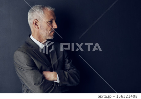 Senior executive, business man and arms crossed, confidence and management on dark background. Male CEO, corporate director in suit and ambition, mockup space with empowerment and career in studio Senior executive, business man and arms crossed, confidence and management on dark background. Male CEO, corporate director in suit and ambition, mockup space with empowerment and career in studio 136321408