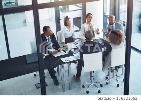 Conversation, business people and team in a meeting for discussion, brainstorming or planning in office. Teamwork, group and corporate colleagues working on a project together in workplace boardroom. Conversation, business people and team in a meeting for discussion, brainstorming or planning in office. Teamwork, group and corporate colleagues working on a project together in workplace boardroom. 136321662