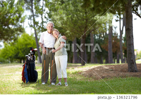 Portrait, smile or happy old couple on golf course in fitness workout, exercise or round together on grass. Embrace, healthy elderly man hugging or smiling in golfing sports game with senior woman Portrait, smile or happy old couple on golf course in fitness workout, exercise or round together on grass. Embrace, healthy elderly man hugging or smiling in golfing sports game with senior woman 136321796