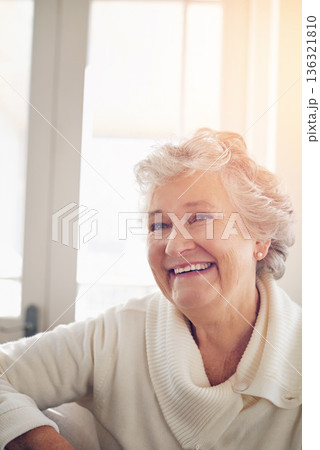 Relax, happy and face of old woman on sofa for free time, retirement and weekend. Smile, happiness and mindset with senior person in living room for elderly, positive and carefree resting at home 136321810