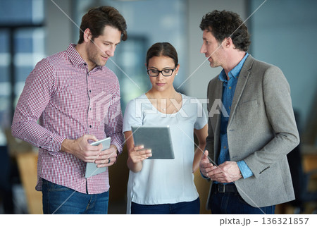 Team talking tablet or business people with research in group meeting or discussion together in office. Diversity, collaboration or employees speaking of technology data analysis or digital network Team talking tablet or business people with research in group meeting or discussion together in office. Diversity, collaboration or employees speaking of technology data analysis or digital network 136321857
