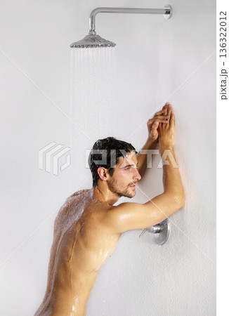 Shower, man rest and bathroom with body cleaning and soap in the morning in home. Water, young male person and smile with hygiene and clean skin care in house with cosmetic grooming and shaving foam Shower, man rest and bathroom with body cleaning and soap in the morning in home. Water, young male person and smile with hygiene and clean skin care in house with cosmetic grooming and shaving foam 136322012