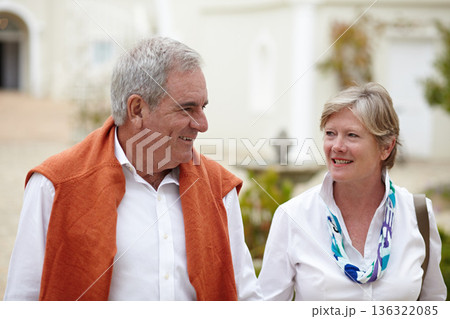 Smile, conversation and a senior couple in the city for a retirement holiday, travel and happiness. Happy, love and an elderly man and woman walking in an old town or hotel during a vacation together Smile, conversation and a senior couple in the city for a retirement holiday, travel and happiness. Happy, love and an elderly man and woman walking in an old town or hotel during a vacation together 136322085