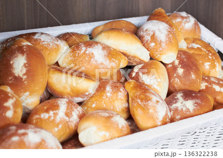 Flour bread, food and bakery basket of rolls from cooking, catering service, breakfast or baking meal at cafe. Bunch of fresh baked or crispy roll snack for eating, nutrition or fiber in restaurant 136322238
